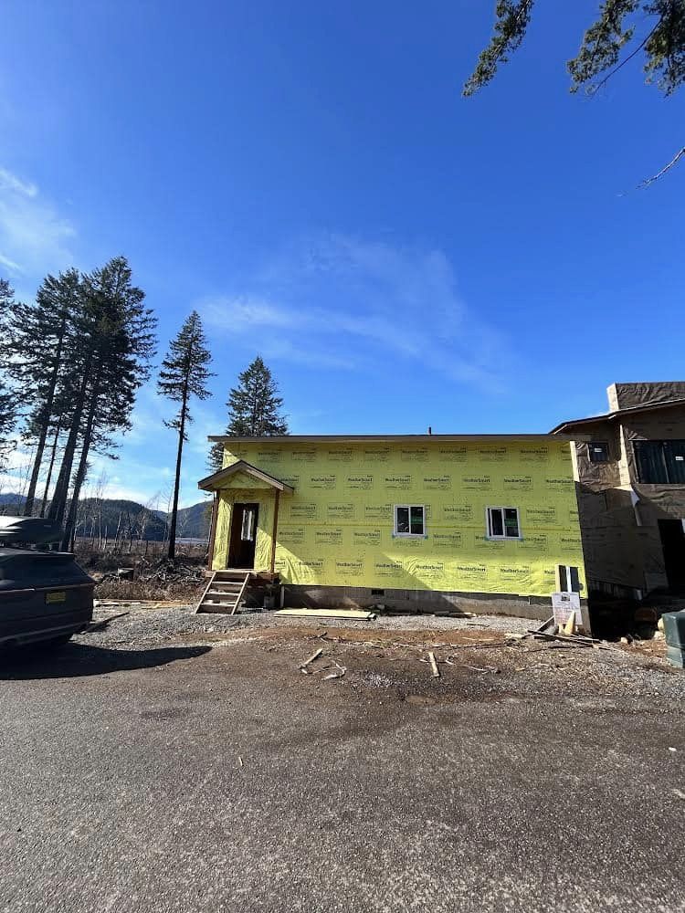 Boyes house during construction — exterior framing and wrap